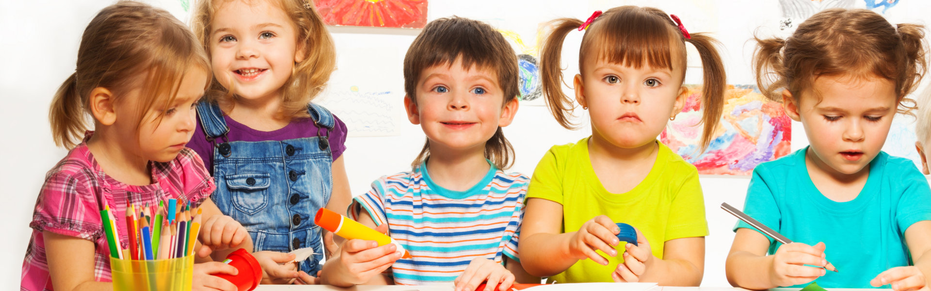 Gluing and painting lesson happy kids by the table