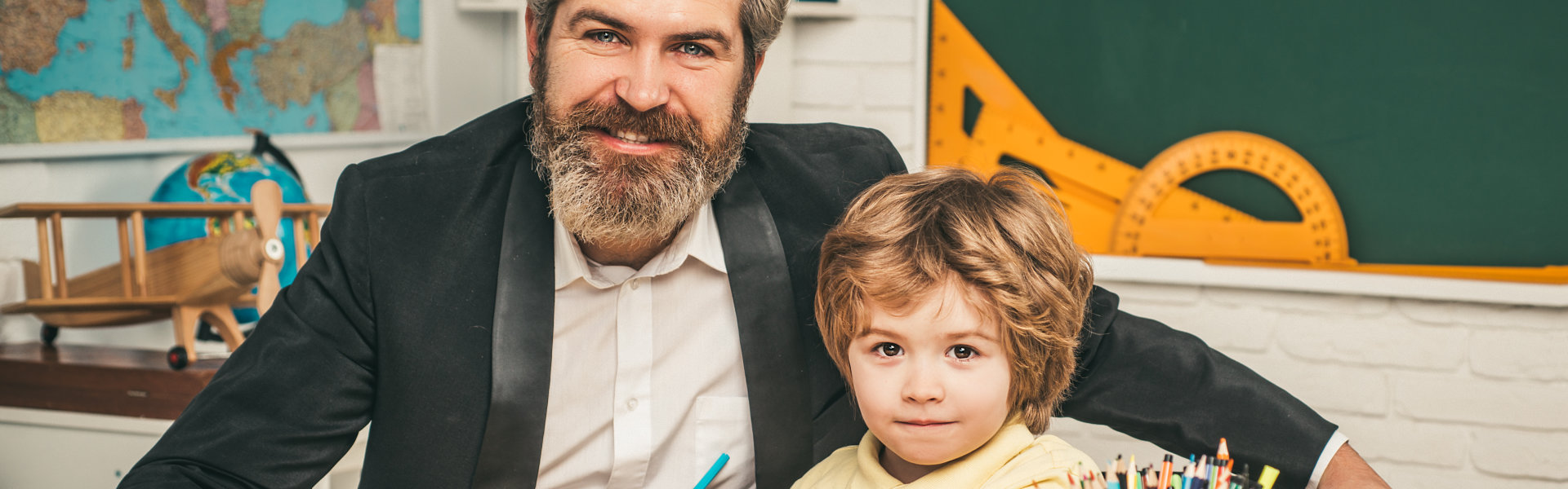 teacher and child smiling